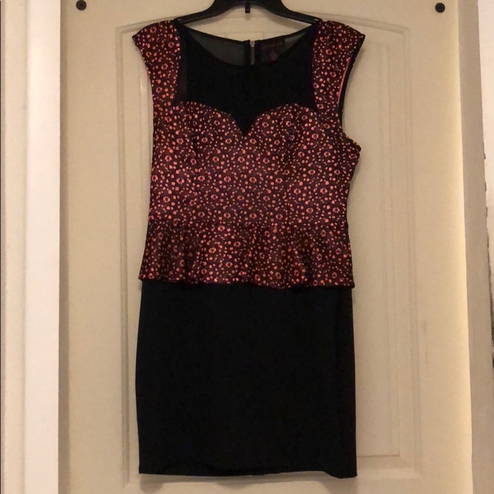Bright coral & black dress with a see-through back